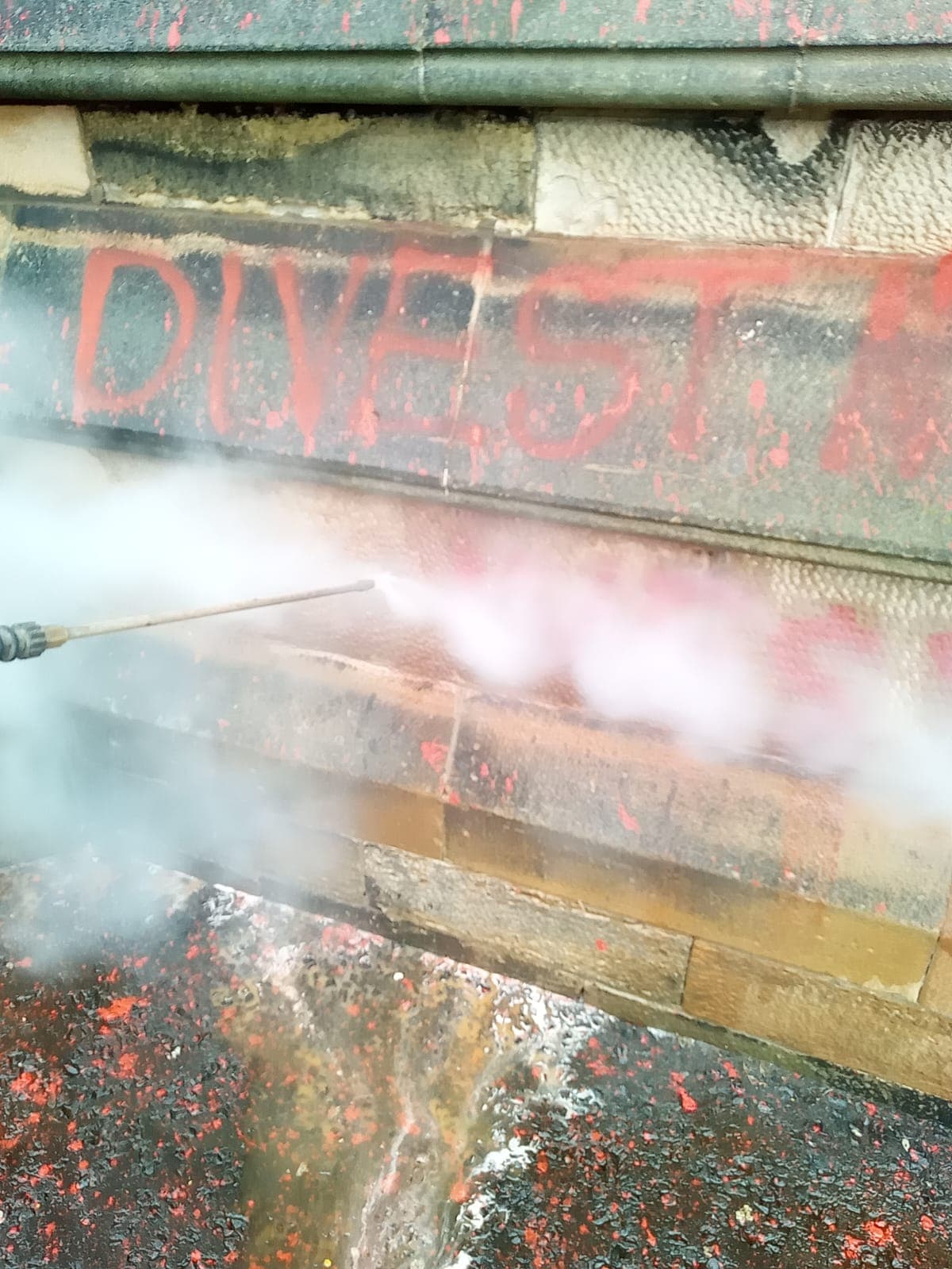 Struan DOFF steam cleaning removing graffiti from heritage stone building