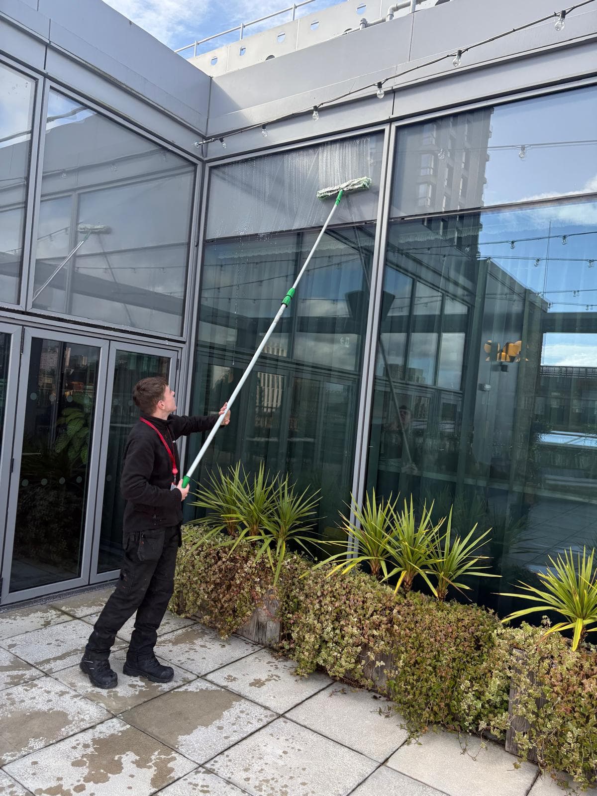 Struan commercial window cleaning using water-fed pole system on office building facade