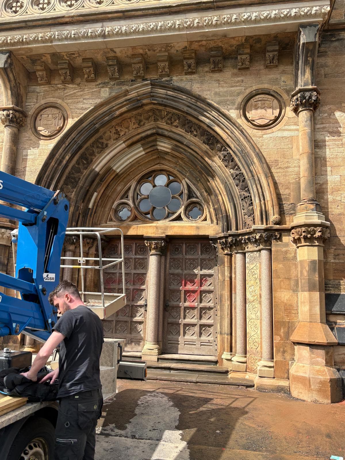 Struan DOFF steam cleaning on heritage building with MEWP access